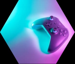 A games controller on a colourful gradient background